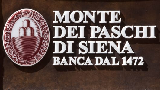 The Monte dei Paschi di Siena SpA logo is seen on one of the bank's branches in Rome, Italy.